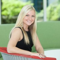 Rachel sits on a chair
